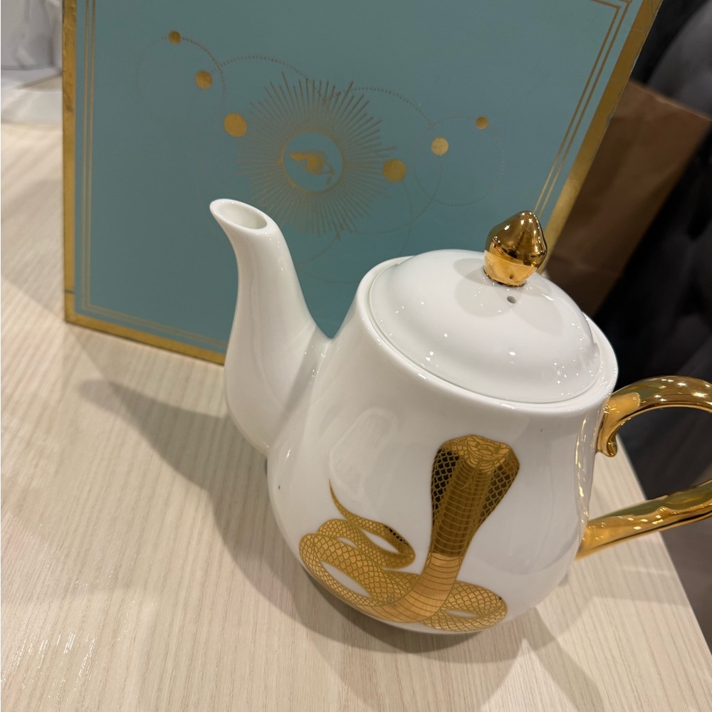 Elegant White and Gold Teapot with Cobra Design